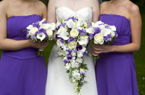 bride and bridesmaids with wedding bouquets