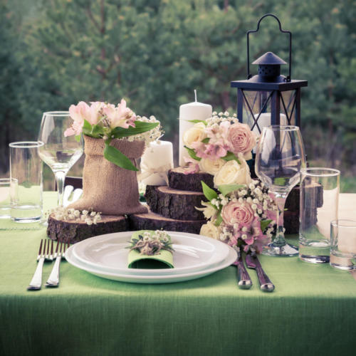 Wedding table setting decorated in rustic style. Retro styled ph